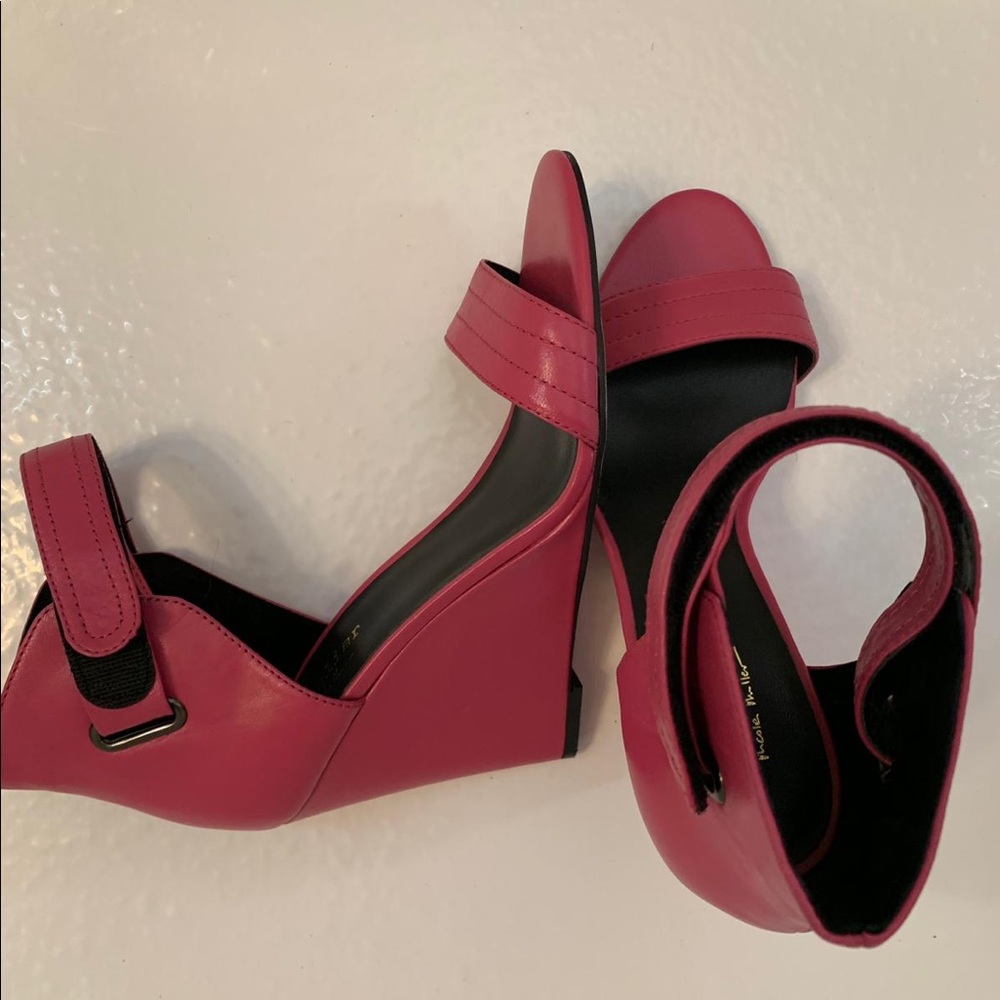Nicole Miller wedge 4.5 inches high.
